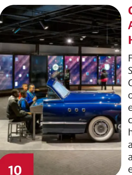 Visitors view a classic car exhibit at the Smithsonian National Museum of African American History and Culture.