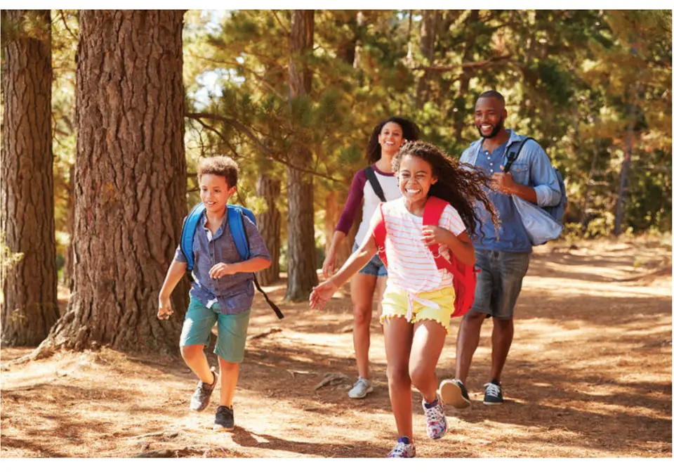 Family hiking on a trail. (Bigstock/MonkeyBusinessImages)