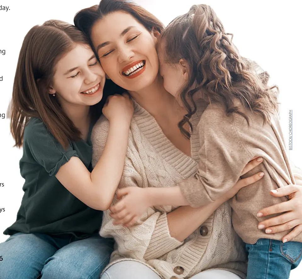 A mother is embraced by her two daughters. (iStock/Choreograph)