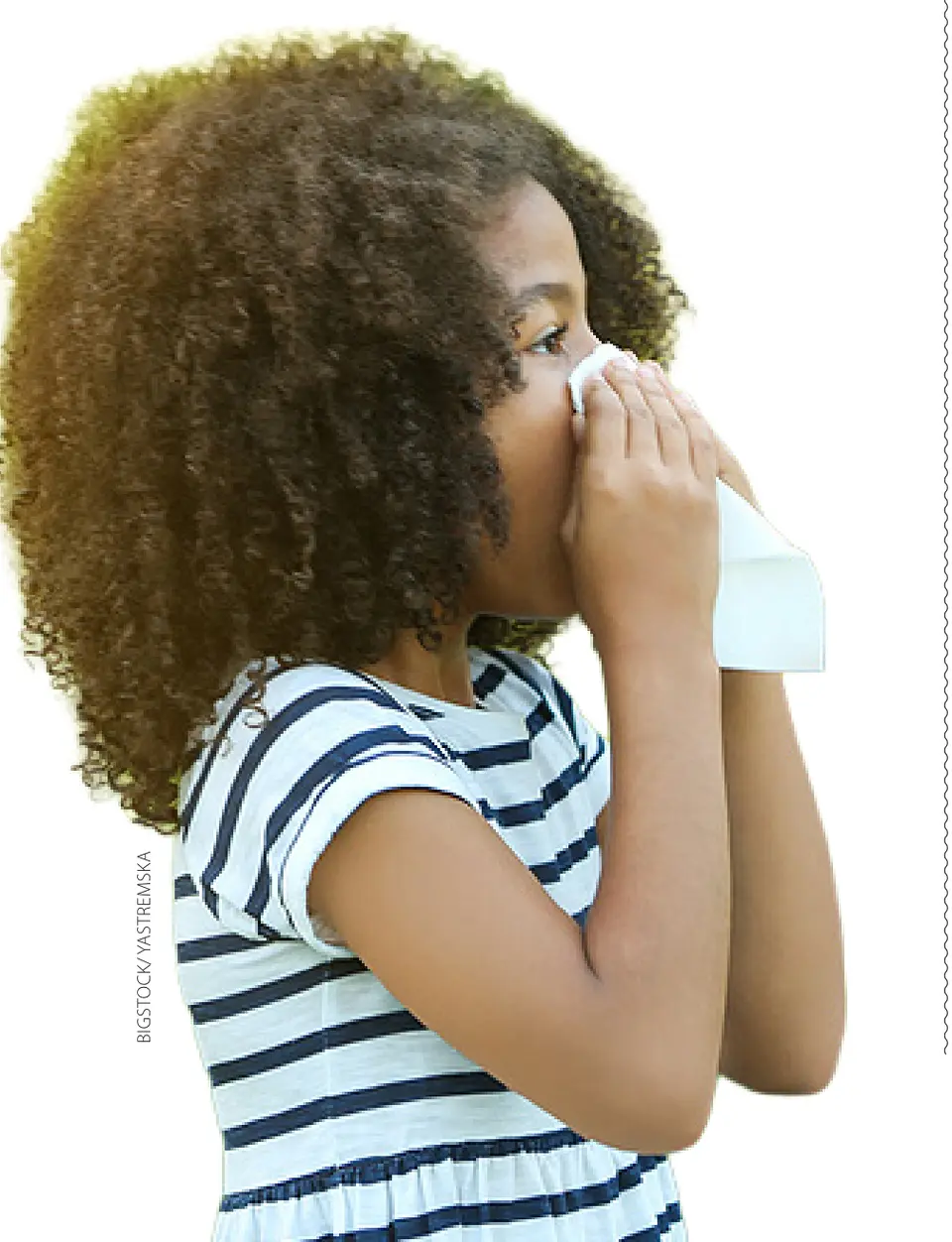 A girl blowing her nose. (Bigstock/Yastremska)