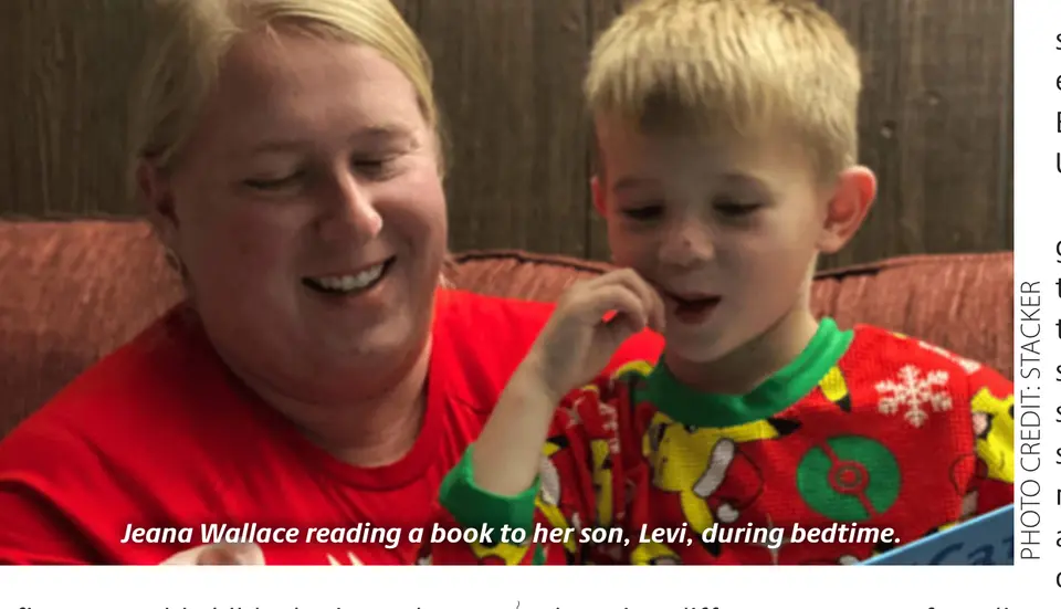 Jeana Wallace reading a book to her son, Levi, during bedtime. (Photo credit: Stacker)