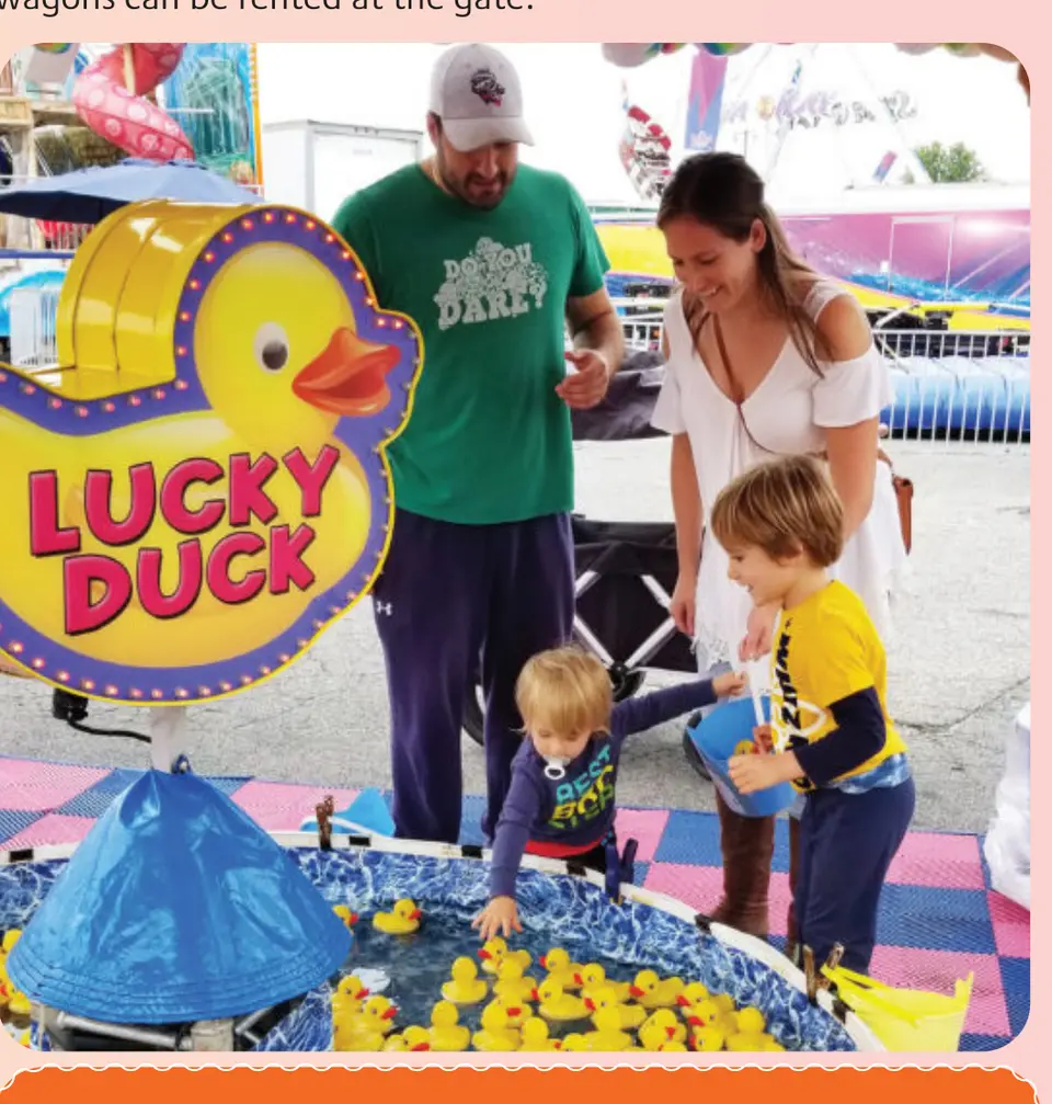 A family plays the Lucky Duck game at the fair.
