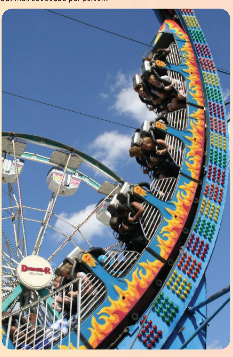 Riders spin on a brightly painted carnival ride.