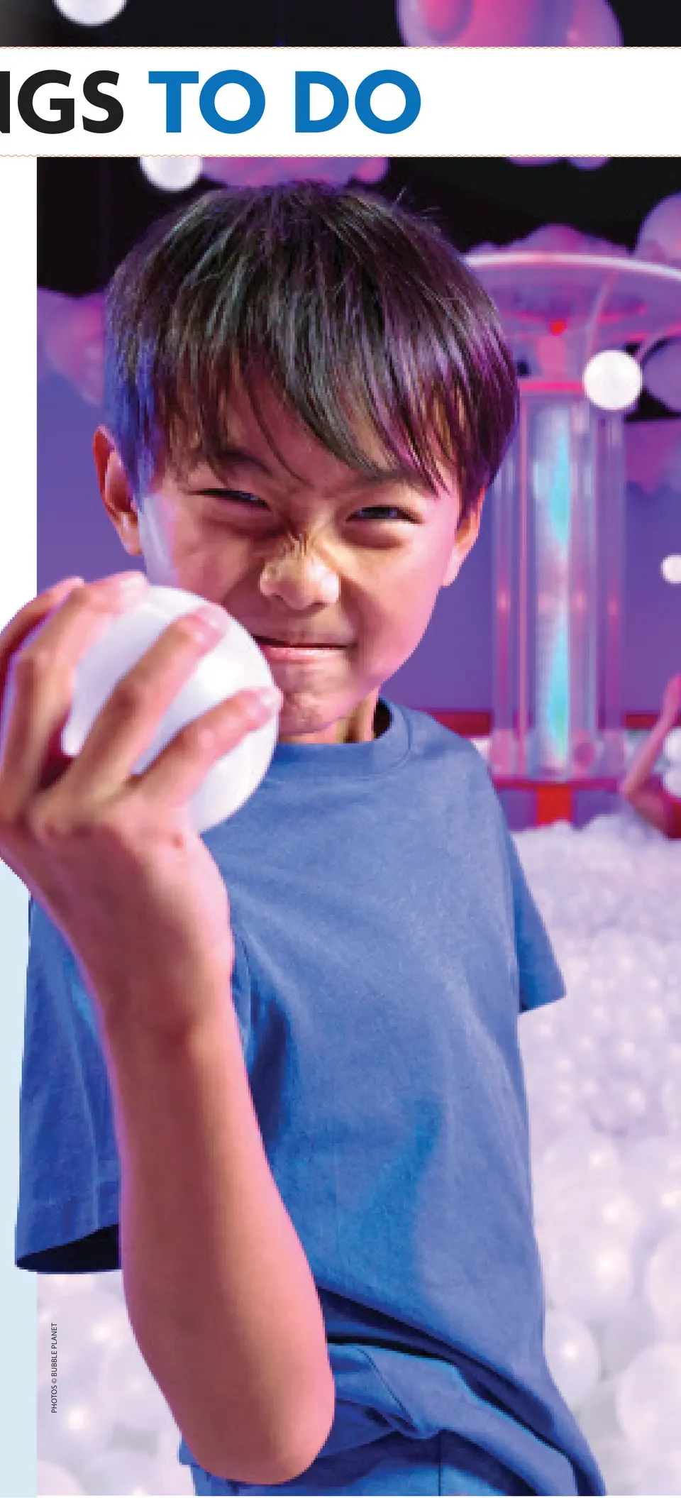 A young visitor holds up a bubble-like ball at Bubble Planet. Photos © Bubble Planet
