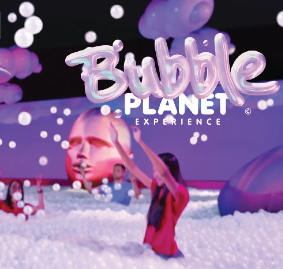 Kids wade through the Bubble Pit ball room at the Bubble Planet Experience.