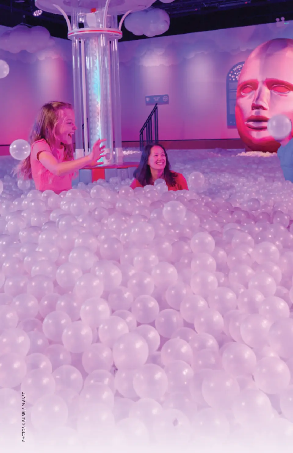 Visitors play in the pink-lit Bubble Pit. Photos © Bubble Planet